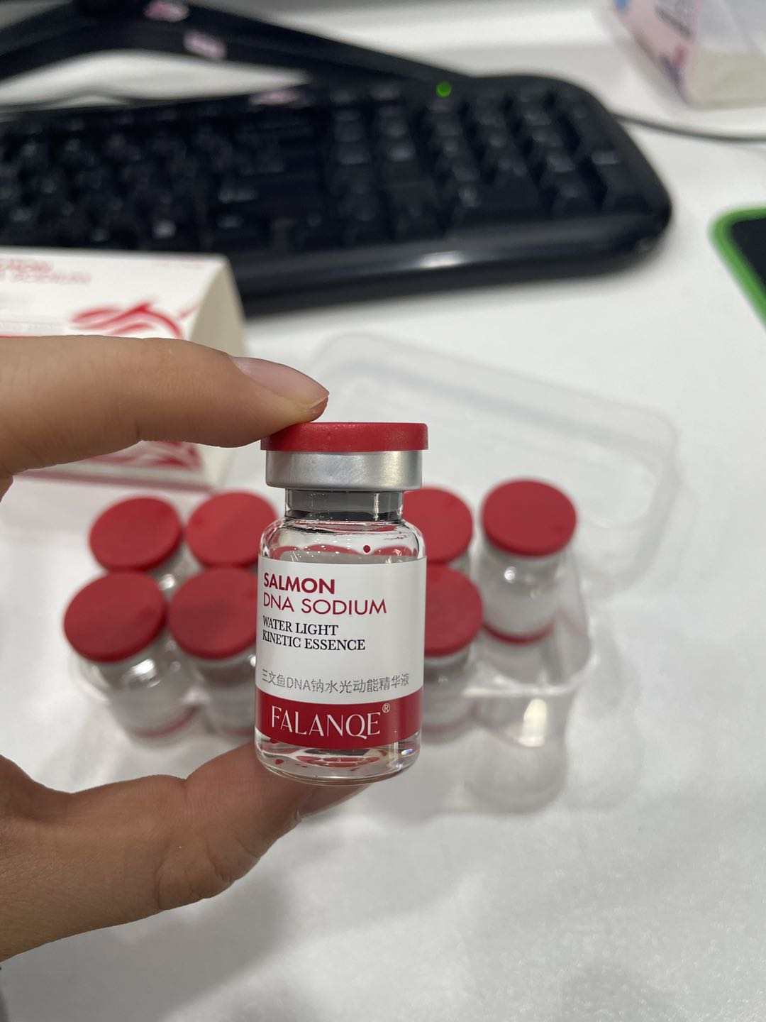 FALANQE Salmon DNA Sodium Water Light Kinetic Essence – set of glass vials with red caps and box packaging, lifts and tightens skin, anti-wrinkle and wrinkle smoothing