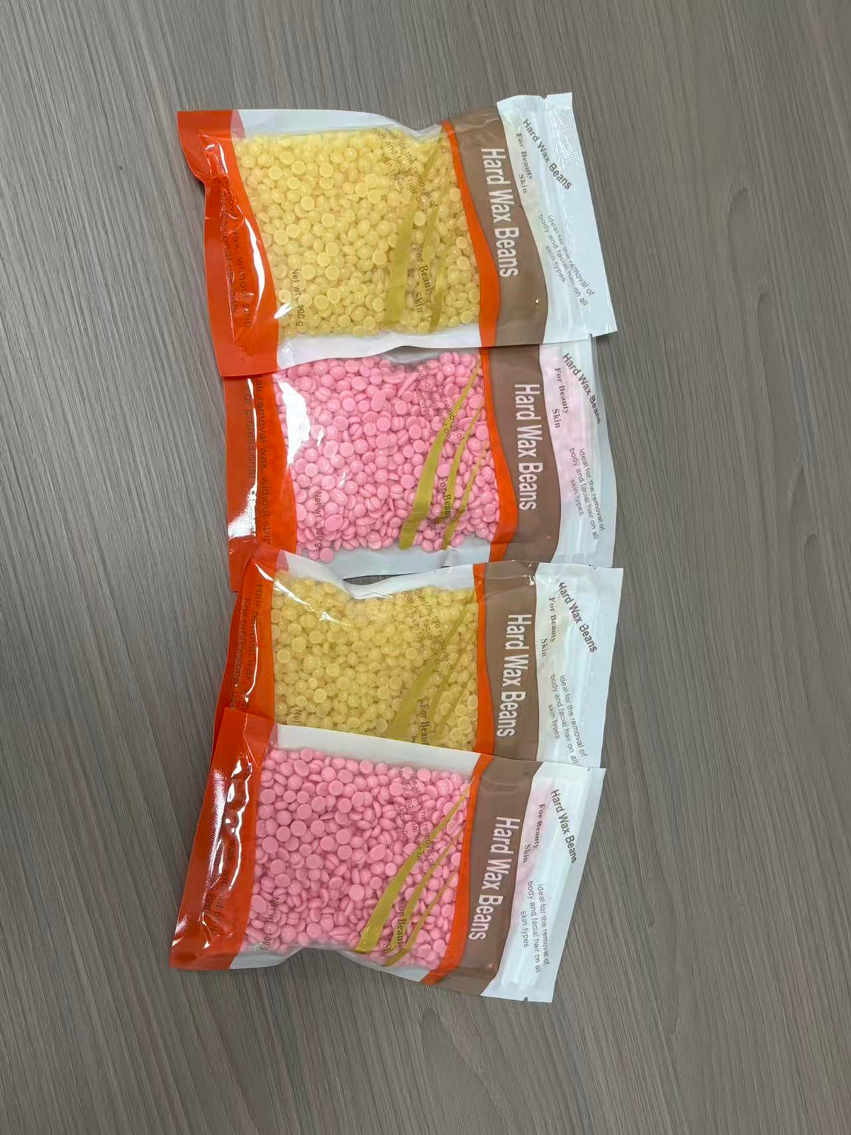 Hard wax beans for body and facial hair removal in 10 scents: Chocolate, Black, Lavender, Chamomile, Cream/Milk, Honey, Tea Tree, Aloe Vera, Rose, Strawberry – suitable for all skin types